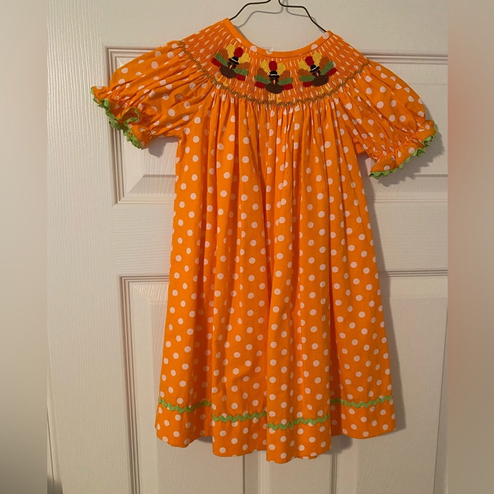 Precious Thanksgiving/turkey dot smocked dress.
